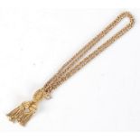 A 15ct gold ornate fob watch chain with tassel ends and engraved slider, 25.5g.