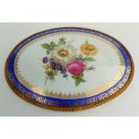 An English porcelain oval plaque, 19th century, with hand painted floral decoration,