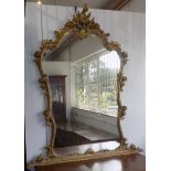 A gilt composition overmantle wall mirror, the frame with acanthus leaves and flowers, height 143cm,