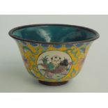 A Chinese enamelled tea bowl, the yellow ground with four roundels enclosing figures,