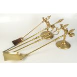 A set of Victorian brass fire irons and andirons.