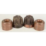 A pair of plain copper ring jelly moulds signed Temple & Crook Ironmongers,