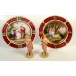 A pair of Vienna porcelain wall plaques, decorated with classical figures, diameter 30.
