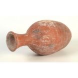A polished terracotta amphora jar, possibly Roman,