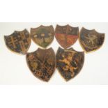 A group of six heraldic, japanned metal shields, height 22.5cm, width 17cm.