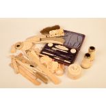 Miscellaneous ivory, circa 1900, including opera glasses, brushes, circular pot etc.