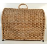 A large wicker basket, with a pair of carrying handles and single door, height 48cm, length 59.