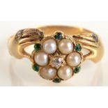 An 18ct gold ring in Georgian style with a pearl diamond and emerald cluster supported by a pair of