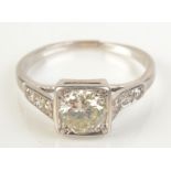 An 18ct white gold solitaire diamond ring of approximately 1ct spread set in a square bezel,
