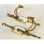 A pair of brass wall lights, 20th century, each set with a mirrored plate, height 35cm.