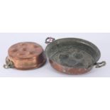 Two circular copper 'L'escargot' pans, diameters 24cm and 19.3cm.