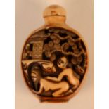 A Chinese snuff bottle, decorated with erotic scenes, height 6.1cm, width 4.2cm.