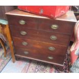 A George III oak chest of drawers, with two short and three long drawers, on bracket feet,
