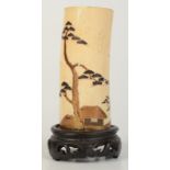 A Japanese Shibayama ivory tusk vase, Meiji period, decorated with trees, boats and a hut,