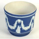 A Wedgwood blue jasperware jardinere, decorated with classical figures, swags and lions' masks,