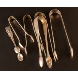 Six pairs of silver tongs, 6.3oz.