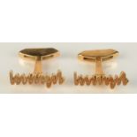 A pair of 18ct gold Plessey logo cuff links dated 1965, 12.35g.