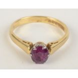 An 18ct gold post war ring set a ruby, size N, 3.2g.