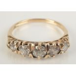 A Victorian gold five stone diamond ring with chased setting, size N.