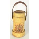 A yellow painted leather shell holder, decorated with a coat of arms, height 31.5cm, diameter 17cm.