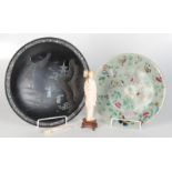 A Chinese papier mache and mother of pearl wall plaque, diameter 30cm, a Japanese ivory figure,