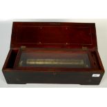 A 33cm cylinder music box with internal wind, in marquetry veneered rosewood case.