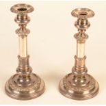 A pair of silver plated telescopic candlesticks, extended height 34cm.