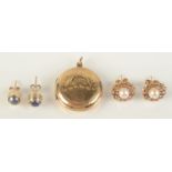 Two pairs of gold earrings and a gold back and front locket.