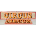 Two painted Circus signs.