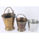 Two brass buckets, heights 26.5cm and 19.5cm and a metal bucket.