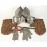 A pair of steel gauntlets with transverse lames,