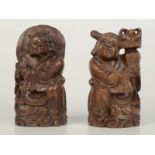 A pair of Chinese carved hardwood figures, circa 1900,
