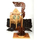 A Chinese hardwood table lamp, early 20th century, in the form of a stylised dragon,