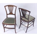 A set of four Edwardian inlaid mahogany side chairs, height 87cm, width 44.5cm.