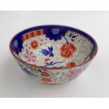 A creamware bowl, early 19th century, floral painted decoration, height 10cm, diameter 23cm.