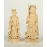 A pair of Chinese ivory chess pieces, circa 1900, the King and Queen, heights 9.6cm and height 8cm.