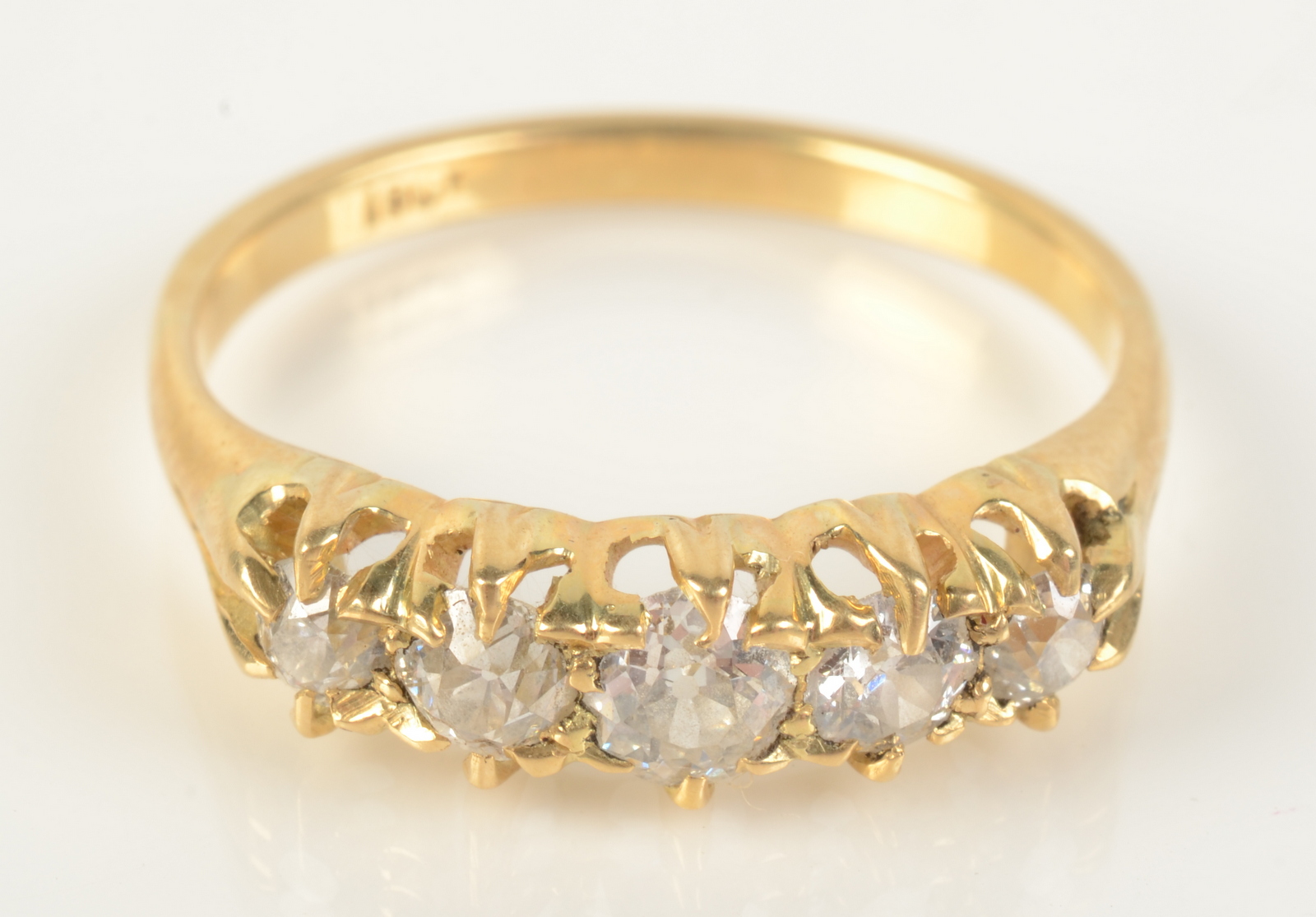 An 18ct gold five stone diamond ring, size P.