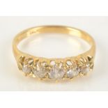 An 18ct gold five stone diamond ring, size P.