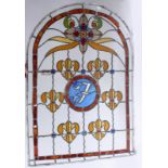 A pair of Victorian stained glass and leaded arched windows,