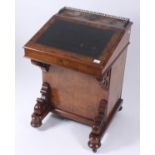 A Victorian burr walnut and marquetry Davenport with a concealed writing compartment and with a