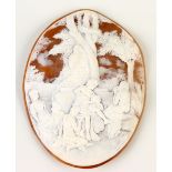 A large carved oval shell cameo by Balzano, it shows a bacchanalian woodland gathering, signed, 10.