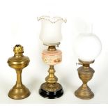 A Victorian brass oil lamp, with opaline glass shade,