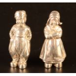 A pair of Bernard Muller silver Dutch boy and girl pepper pots each with English import marks, 2.