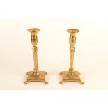 A pair of brass candlesticks, 19th century, height 23.5cm.