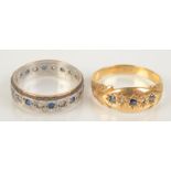 An 18ct gold ring set with sapphires, size P, together with an eternity ring, size M.