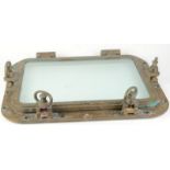 A rectangular brass porthole with hinged window, 70 x 56cm.