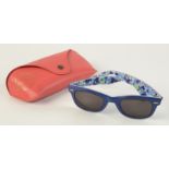A pair of ladies Ray Ban Wayfarer Special Series sunglasses in red case.
