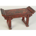 A Chinese red lacquered wooden model of an altar table, circa 1900,