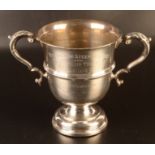 A Georgian style silver twin handle trophy cup, 16.5oz.