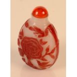 A Peking red and white carved over lay snuff bottle, height 7cm.